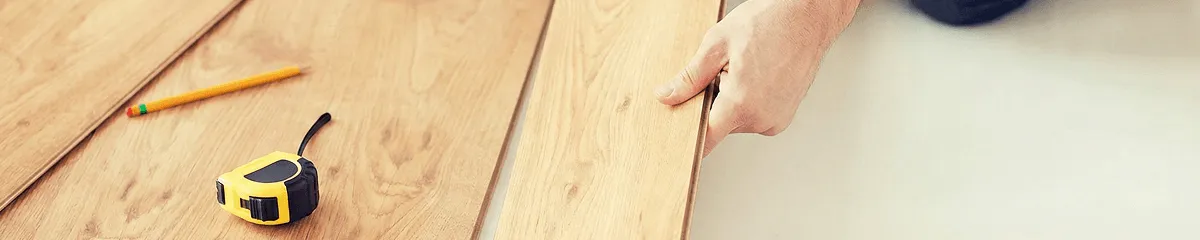 A professional installing wood flooring in Dayton, OH