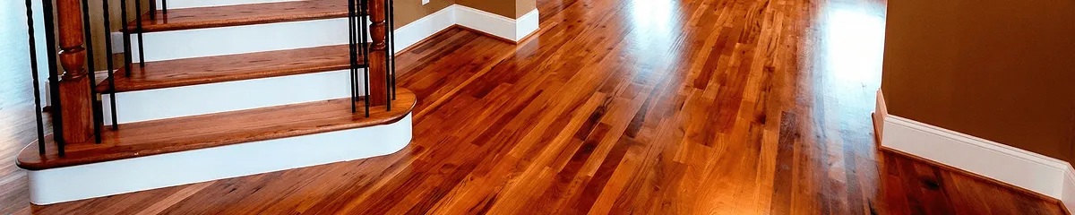 Base floor of a staircase with professionally restored wood flooring in Dayton OH