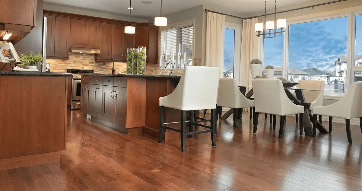 A modern kitchen with professionally installed wood flooring in Dayton, OH